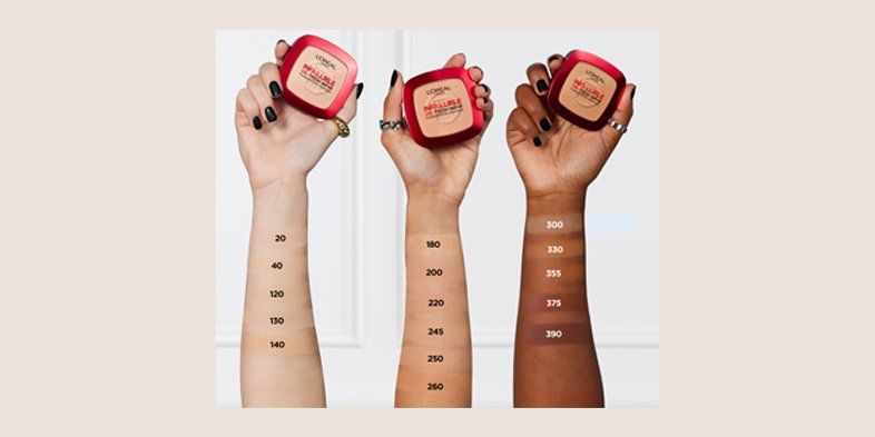 Hands holding pressed powder foundation